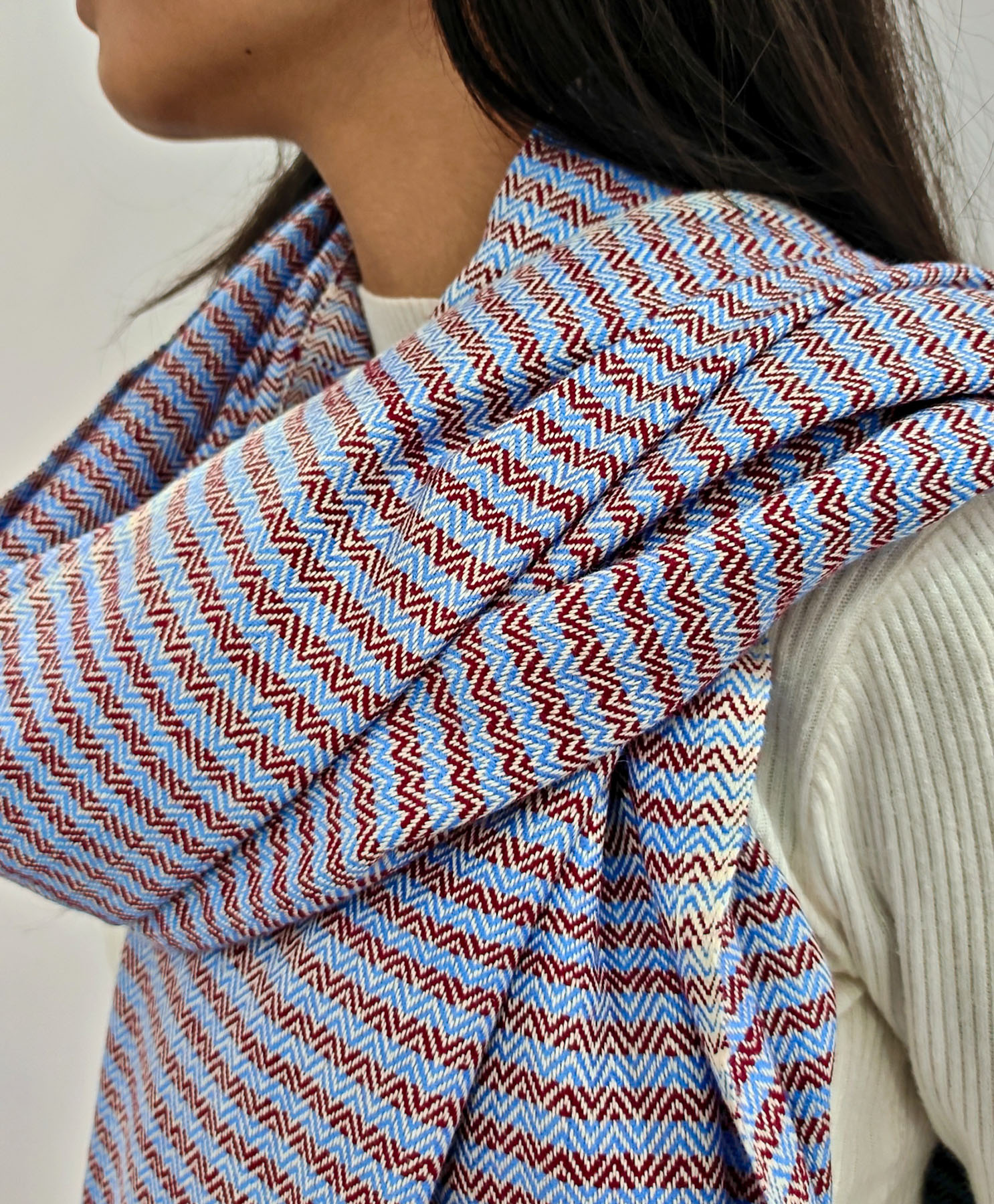 handwoven maroon and blue shawl Close-up of handwoven maroon and blue shawl