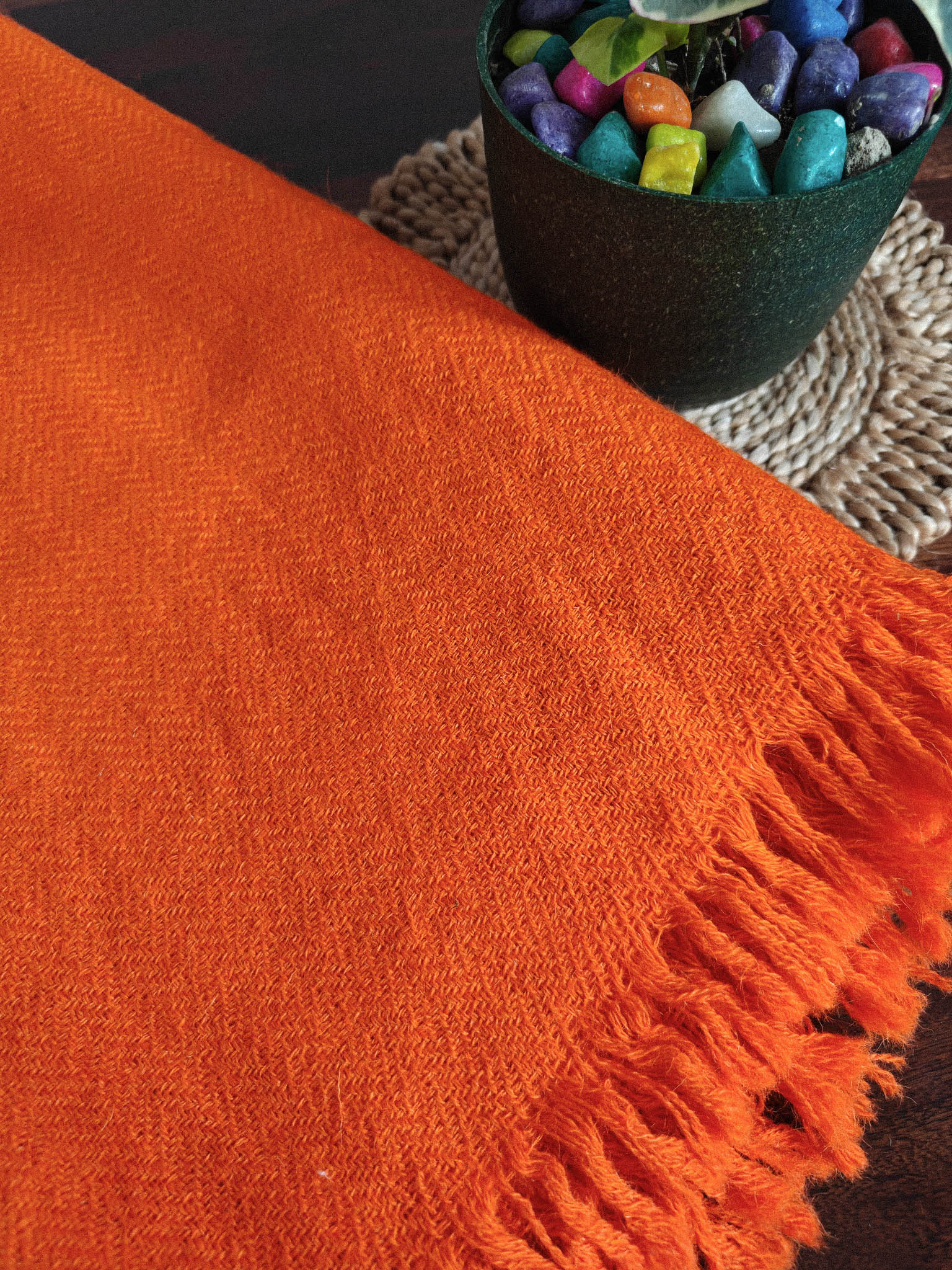 Handwoven bright orange shawl Close-up of handwoven bright orange himalayan wool shawl