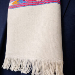 Close-up of Handwoven white muffler with multicoloured pattern