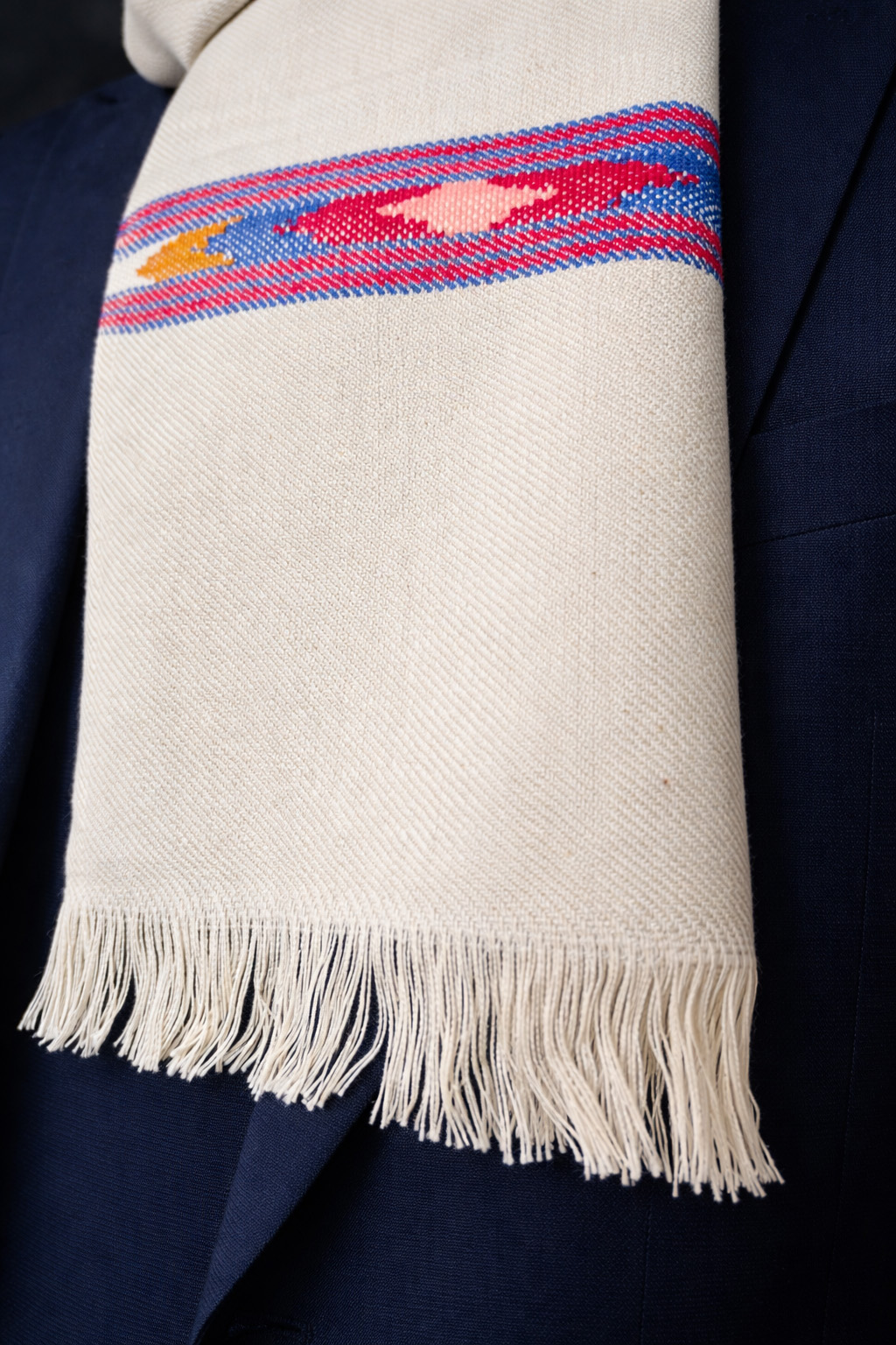 handwoven multicolour pattern design muffler Close-up of Handwoven white muffler with multicoloured pattern